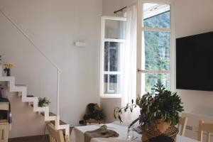 a dining room with a table and a window at My Place Your Place in Corniglia