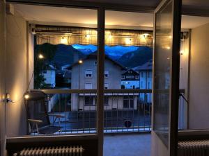 a window with a view of a mountain view at Beau T2 rénové in Cluses