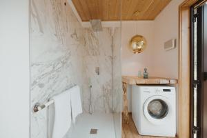 a laundry room with a washer and dryer at E-glamping/Blue Saphir Tent in Arezzo