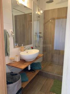 a bathroom with a sink and a shower at Victory apartmán in Šamorín