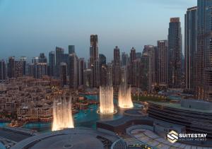 a view of a large city with tall buildings at Deluxe - Address Dubai Mall - The Residence in Dubai