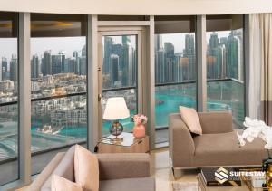 a living room with a view of a city at Deluxe - Address Dubai Mall - The Residence in Dubai