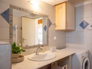 a bathroom with a sink and a mirror at Trip's House: εξοχικό σπίτι με θέα στη θάλασσα. in Ambelas +19 photos