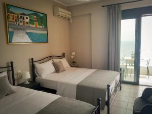 Postel nebo postele na pokoji v ubytování Anel Rooms