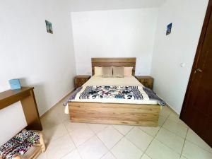 Voodi või voodid majutusasutuse Appartement centre oued laou avec piscine été toas