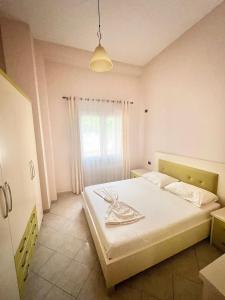Postel nebo postele na pokoji v ubytování Marika Apart Hotel
