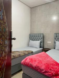 Ένα ή περισσότερα κρεβάτια σε δωμάτιο στο Chez layla