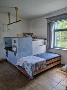 Postel nebo postele na pokoji v ubytování Statek u Benešů