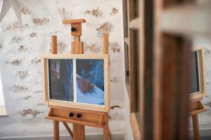 a small wooden box tv on a stand at Militiko in Himare
