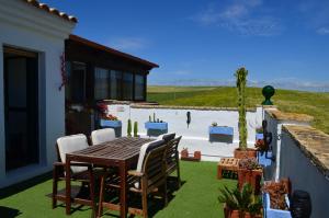 En balkon eller terrasse på BONITO ÁTICO AIRE ACONDICIONADO y BARBACOA