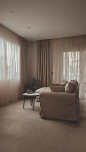 A seating area at Theros Luxury Apartment
