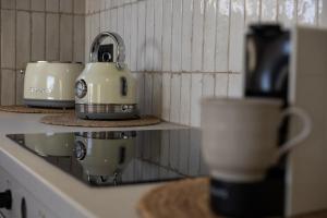 Coffee and tea making facilities at Theros Luxury Apartment