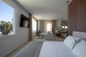A bed or beds in a room at Theros Luxury Apartment