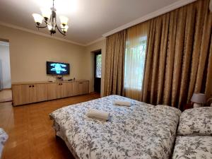 a bedroom with a bed with two pillows on it at Geo Kutaisi in Kutaisi