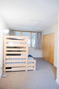 a bedroom with a bunk bed and a window at NEW! Townhouse - Tenney Mountain Resort in Plymouth