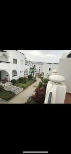 a view of a street with white buildings at villa amplia y acogedora-alcudia smir in Fnidek