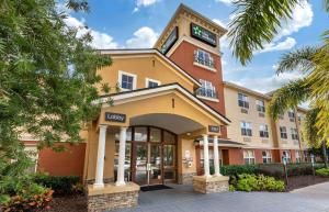a rendering of a hotel with a building at Extended Stay America Suites - Orlando - Maitland - Summit Tower Blvd in Orlando