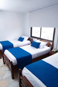 Uma cama ou camas num quarto em Hotel Steven