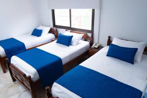 Uma cama ou camas num quarto em Hotel Steven