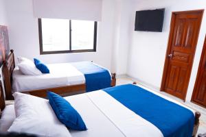 Uma cama ou camas num quarto em Hotel Steven