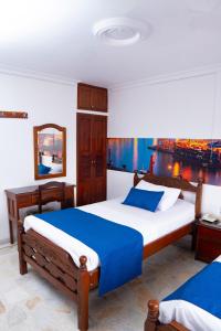 Uma cama ou camas num quarto em Hotel Steven