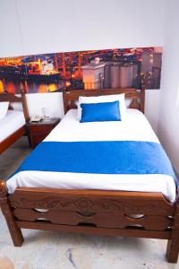 Uma cama ou camas num quarto em Hotel Steven