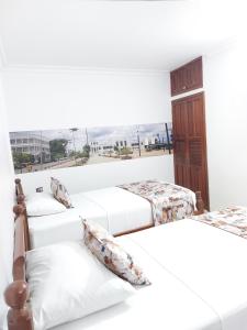 Uma cama ou camas num quarto em Hotel Steven