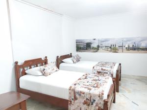 Uma cama ou camas num quarto em Hotel Steven