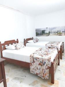 Uma cama ou camas num quarto em Hotel Steven