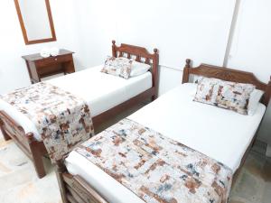 Uma cama ou camas num quarto em Hotel Steven