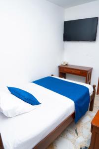 Uma cama ou camas num quarto em Hotel Steven