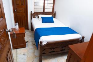 Uma cama ou camas num quarto em Hotel Steven