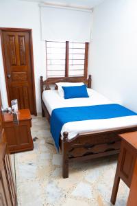 Uma cama ou camas num quarto em Hotel Steven