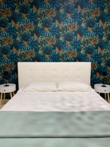 A bed or beds in a room at Casa Ammare
