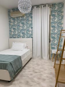 A bed or beds in a room at Casa Ammare