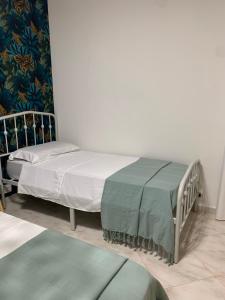 A bed or beds in a room at Casa Ammare