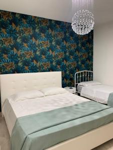 A bed or beds in a room at Casa Ammare
