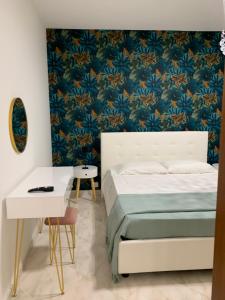 A bed or beds in a room at Casa Ammare