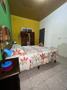 a bedroom with a bed and a table at Casa Maya Itza in Flores