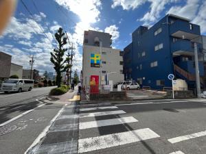 an empty street with a building on the side of the road at N's Home - 南名古屋駅一軒家 - 8 in Nagoya
