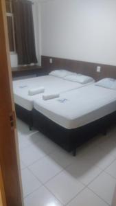 2 camas en una habitación con en HOTEL DA RODOVIARIA en Belém