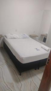 Ένα ή περισσότερα κρεβάτια σε δωμάτιο στο HOTEL DA RODOVIARIA