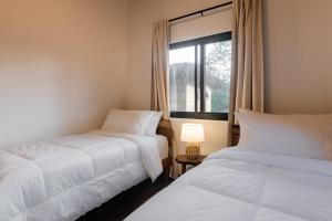 Postel nebo postele na pokoji v ubytování Dos Mares Venao Village