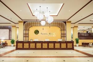 a lobby of a resort with a sign that reads simply beach at Sunny Beach Resort & Spa in Mui Ne