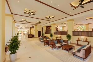 a lobby of a hospital with chairs and tables at Sunny Beach Resort & Spa in Mui Ne