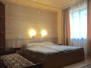 Postel nebo postele na pokoji v ubytování Pryvatna sadyba Svitanok