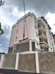 a building with writing on the side of it at Exquisite two bedroom Penthouse-Fully Furnished in Kitale