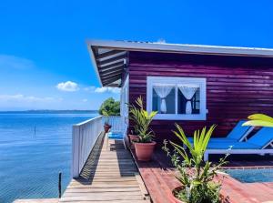 a house on the water with a dock at Round the point Bungalow in Bastimentos