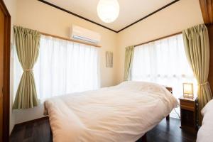 เตียงในห้องที่ New! Kamata close Haneda AP - Traditional & Hot Spring
