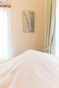 เตียงในห้องที่ New! Kamata close Haneda AP - Traditional & Hot Spring
